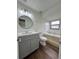 A full bathroom featuring a gray vanity and new fixtures near a tub and toilet at 3006 S Semoran Blvd # 7, Orlando, FL 32822