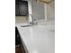 Close-up of kitchen countertop, faucet, and gray cabinets at 3006 S Semoran Blvd # 7, Orlando, FL 32822