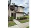 Inviting two-story exterior of this home featuring lush landscaping and a private entrance at 3006 S Semoran Blvd # 7, Orlando, FL 32822