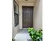 A welcoming front door with the number 7, with healthy green plants at 3006 S Semoran Blvd # 7, Orlando, FL 32822