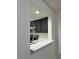 Kitchen passthrough with white countertop and gray cabinets at 3006 S Semoran Blvd # 7, Orlando, FL 32822