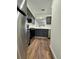 Efficient kitchen with stainless steel appliances and stylish gray cabinetry at 3006 S Semoran Blvd # 7, Orlando, FL 32822