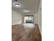 Bright living room featuring hardwood floors, lots of natural light, and a sliding glass door at 3006 S Semoran Blvd # 7, Orlando, FL 32822