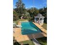 Backyard pool features a slide and gazebo with ample outdoor seating at 1116 W Line St, Leesburg, FL 34748