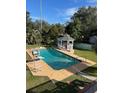 Backyard pool features a slide and gazebo with ample outdoor seating at 1116 W Line St, Leesburg, FL 34748