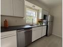 Modern kitchen featuring stainless steel appliances, sleek countertops, and ample natural light at 766 Bates Sw Ave, Winter Haven, FL 33880