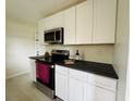 Modern kitchen featuring stainless steel appliances, stylish countertops and bright white cabinetry at 766 Bates Sw Ave, Winter Haven, FL 33880