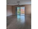 Bright living room with sliding glass doors leading to outdoor space and neutral-toned walls at 3110 Port Royal Dr, Orlando, FL 32827