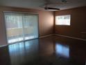 Bright living room featuring a ceiling fan and polished concrete floors at 3110 Port Royal Dr, Orlando, FL 32827