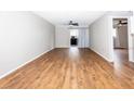 Spacious living room with wood-look floors and a ceiling fan for comfort at 948 Lake Destiny Rd # G, Altamonte Springs, FL 32714