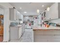 Bright kitchen with white cabinets and an island at 8115 Esperanza St, Orlando, FL 32817