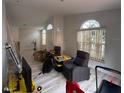 Living room with laminate floors and gray armchairs at 310 Winter Green Dr, Winter Springs, FL 32708