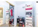 Well-organized bedroom closet with ample shelving and hanging space at 4537 Ring Neck Rd # C, Orlando, FL 32808