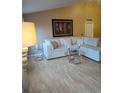 Spacious living room featuring a large sectional sofa and light wood flooring at 15900 Sw 19Th Avenue Rd, Ocala, FL 34473