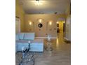 Open living room with a sectional sofa, decorative wall niches, and wood floors at 15900 Sw 19Th Avenue Rd, Ocala, FL 34473
