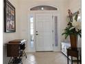 Bright and spacious foyer with tiled floors and decorative accents at 11276 Se 170Th Pl, Summerfield, FL 34491