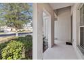 Covered front porch with view of the street at 2016 Sanderlin Point Loop, Apopka, FL 32703