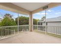 Relaxing screened porch overlooking the backyard at 461 Troy Loop, The Villages, FL 32162