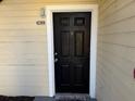 Black front door with white frame and address number 3412 at 1049 S Hiawassee Rd # 3412, Orlando, FL 32835