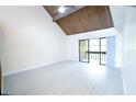 Main bedroom with wood ceilings and access to balcony at 255 Crown Oaks Way, Longwood, FL 32779