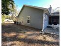 Side view of the house showing additional exterior features at 305 Pinecrest Rd, Mount Dora, FL 32757