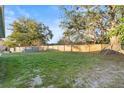 Large backyard with a wooden fence and above ground pool at 3249 Lake Helen Osteen Rd, Deltona, FL 32738