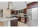 Modern kitchen with granite countertops, stainless steel appliances, and an island at 4539 Wild Rose Ct, Orlando, FL 32808