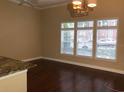 Bright and spacious living room with hardwood floors and large windows at 705 Celebration Ave # 705, Celebration, FL 34747