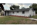 Ranch-style house with a brick planter and neat landscaping at 11331 Northern Ave, Leesburg, FL 34788