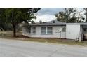 Cute one-story home with a well-maintained lawn at 11331 Northern Ave, Leesburg, FL 34788