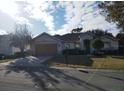 One-story house with a two-car garage and well-manicured lawn at 13026 Se 97Th Terrace Rd, Summerfield, FL 34491