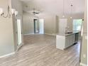 Modern kitchen featuring an island, stainless steel appliances, and light cabinetry at 6435 Sw 204 Ave, Dunnellon, FL 34431
