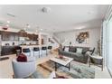 Bright living room open to kitchen with modern finishes and stainless steel appliances at 921 Paradise Dr, Davenport, FL 33897