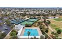 An aerial view of a pool, pickleball courts and tennis courts at the community center at 2378 Ridgeway Ct, The Villages, FL 32162