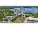 Aerial view of the condo complex situated on the lake, showcasing the community's amenities at 13427 Blue Heron Beach Dr # 2106, Orlando, FL 32821