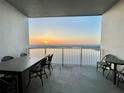 Relax on this outdoor balcony overlooking the lake; it's perfect for dining and entertaining guests at 13427 Blue Heron Beach Dr # 2106, Orlando, FL 32821
