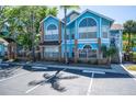 Inviting blue condo with decorative windows and convenient parking spaces at 2735 N Poinciana Blvd # 103, Kissimmee, FL 34746