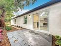 Home back patio showcasing an outdoor living space, perfect for entertaining at 748 Neuse Ave, Orlando, FL 32804