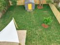 Aerial view of large fenced backyard with shed and sail shade structure at 748 Neuse Ave, Orlando, FL 32804