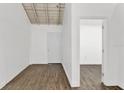 Bright living room boasts wood flooring and white walls, creating a modern and spacious feel at 608 Grand St, Orlando, FL 32805
