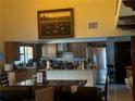 Spacious kitchen with stainless steel appliances and ample counter space at 1818 Lago Ct, St Cloud, FL 34769