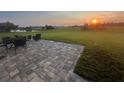 Brick patio set on a large lot overlooks a beautiful countryside at 3345 Tesoro Cir, New Smyrna Beach, FL 32168