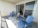 Inviting balcony with comfortable seating, perfect for relaxing and enjoying the outdoors at 13415 Blue Heron Beach Dr # 1407, Orlando, FL 32821