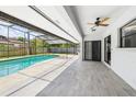 Relaxing screened-in patio area with a private pool, perfect for outdoor entertaining at 1776 E Cheryl Dr, Winter Park, FL 32792