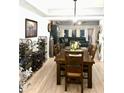 Open dining and living area featuring a hardwood floors and an open concept at 424 Luna Bella Ln # 330, New Smyrna Beach, FL 32168