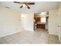 Open living room with tile floors and views to kitchen at 1720 S Warnell Rd, Coleman, FL 33521