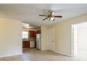 Open living room with tile floors and views to kitchen at 1720 S Warnell Rd, Coleman, FL 33521