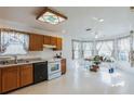 Spacious eat in kitchen features wood cabinets, laminate counters, and lots of natural light at 1606 Center St, Deland, FL 32720