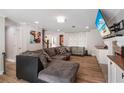 Spacious living room with comfortable seating, neutral walls, wood-look floors, and plenty of natural light at 3333 Se 3Rd Ave, Ocala, FL 34471
