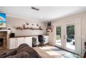 Well-lit living room workspace includes a built-in desk, shelving, and a view to the outdoors at 3333 Se 3Rd Ave, Ocala, FL 34471
